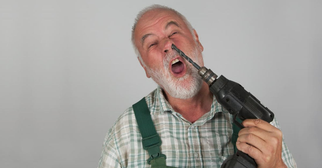 A man shoving a drill up his nose. This is how it feels when you have to choose between Rakuten or Amazon Japan (unless you read this blog post)