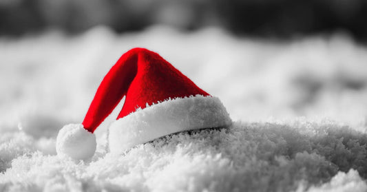 Santa's hat sits abandoned atop a pile of snow. Has Santa placed it there? Has he perhaps been disintegrated into that pile snow?