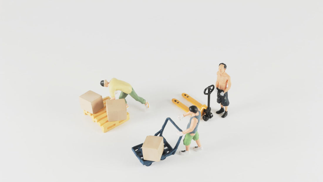 A mini warehouse of mini people move mini boxes on mini pallets while contemplating their mini existence.