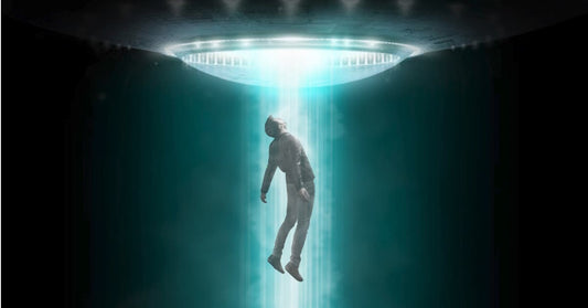 A picture of a man being abducted by a UFO... and not the terrestrial kind. THE EXTRA-TERRESTRIAL KIND. THAT'S RIGHT, THIS DUDE IS ABOUT TO GET PROBED.